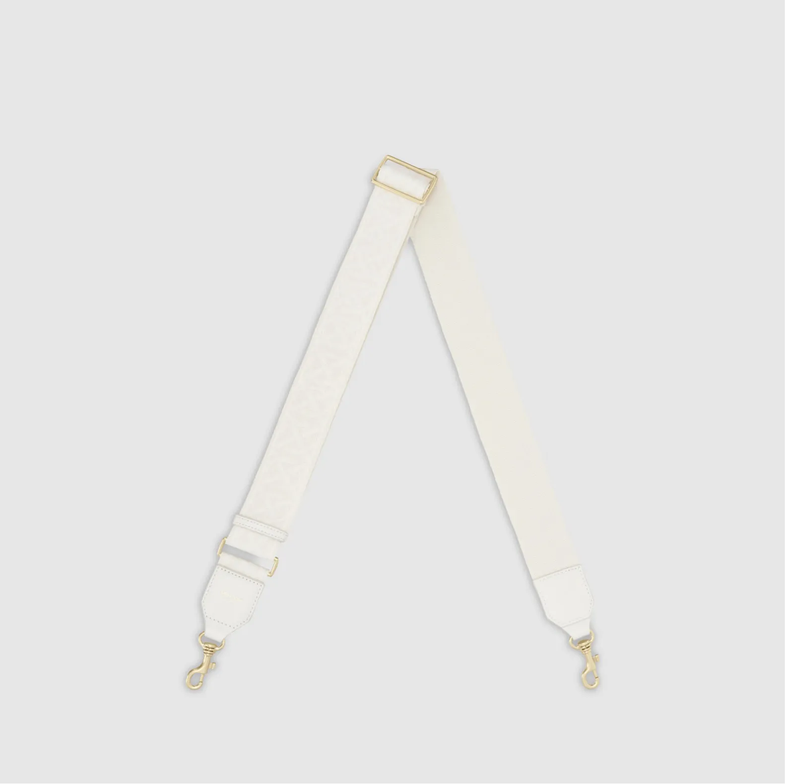 White adjustable strap with gold hardware clips.