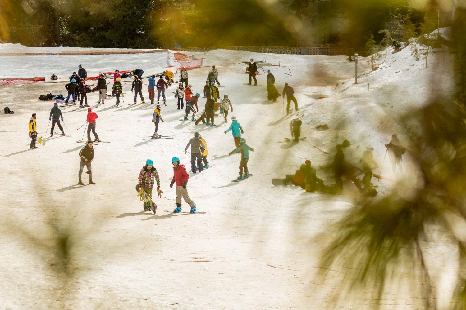 People engaging in activities on a snowy landscape.