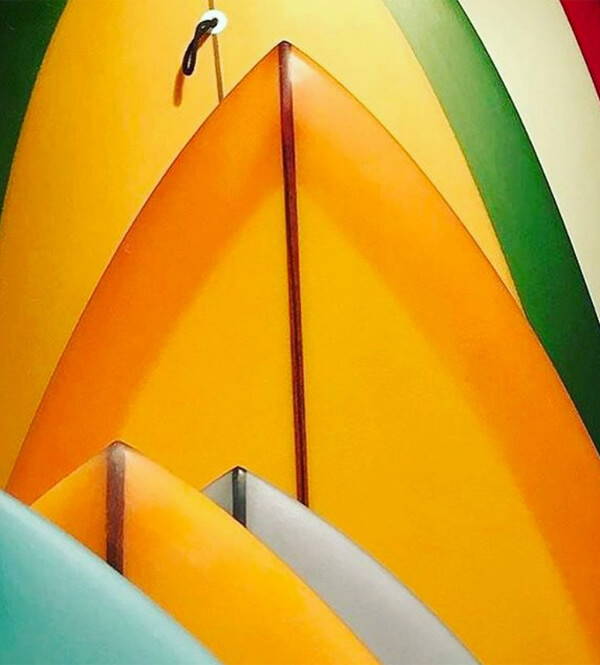 A mood image of bold colourful surf boards forming a graphic shape.