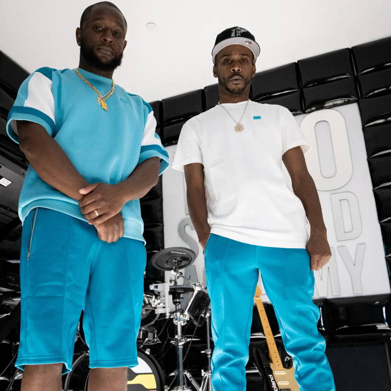 two male models wearing puma x tmc apparel and shoes