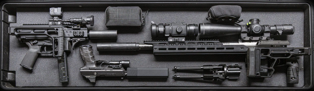 A disassembled firearm with various accessories in a black case.