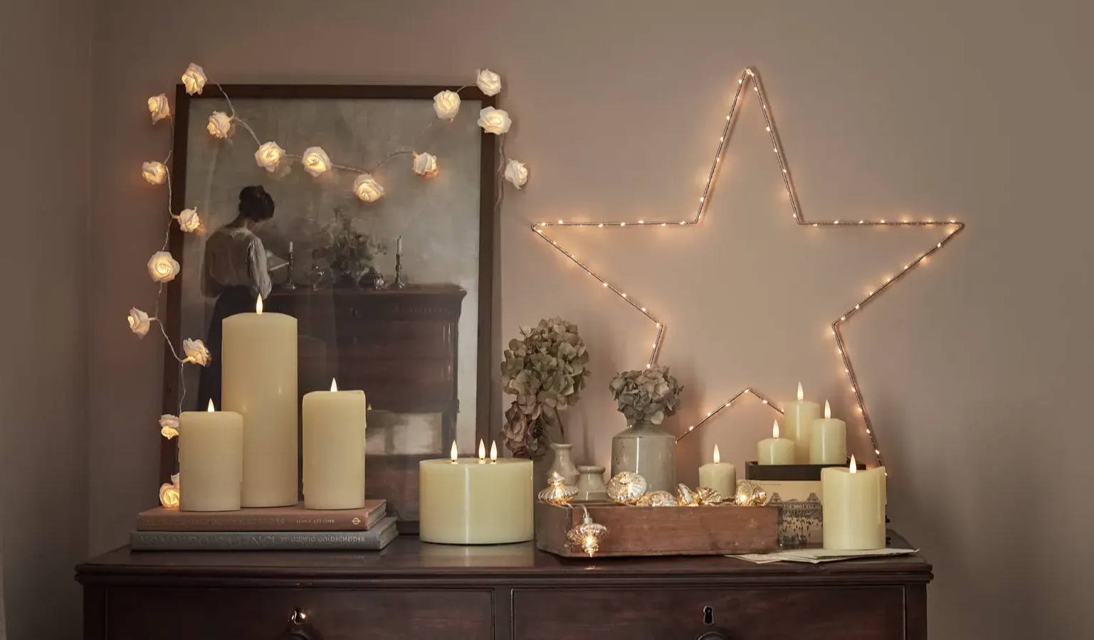 Cosy side table display with LED candles, fairy lights, and an osby star.
