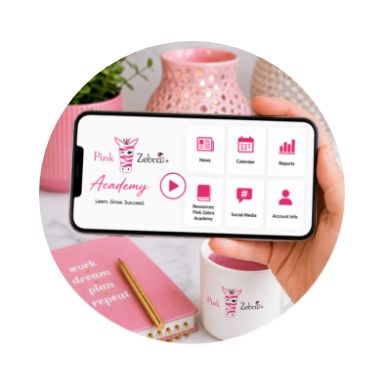 A hand holding a smartphone displaying an app interface with pink accents.