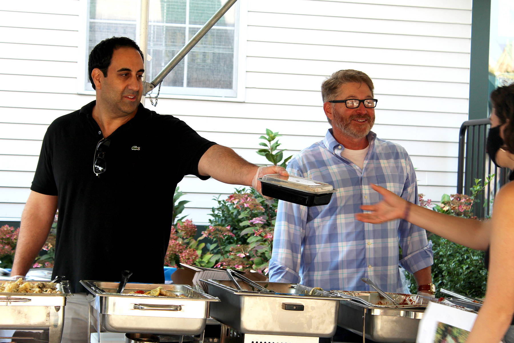 BedJet CEO Mark Aramli serves hot meals to local food pantry clients