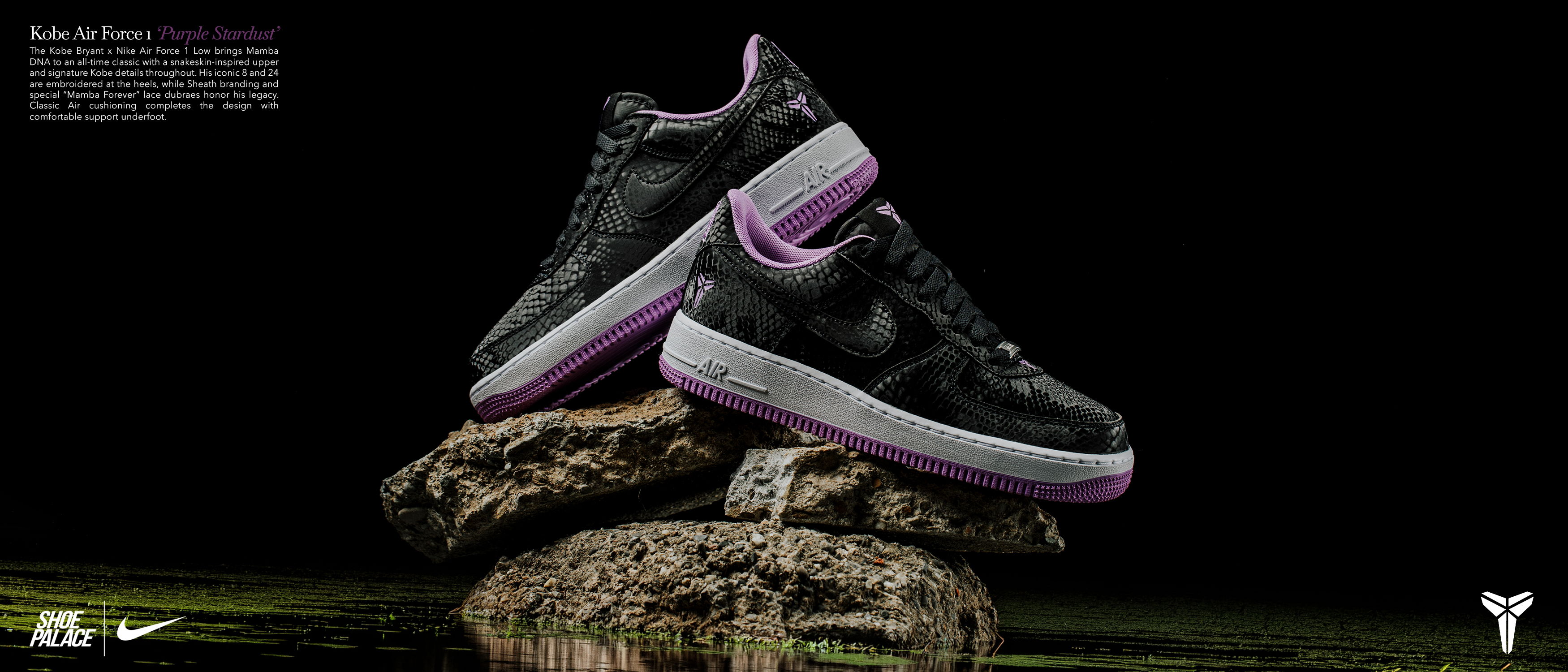 Black and purple sneakers displayed on a rocky surface against a dark background.