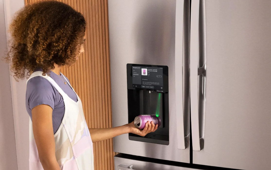 Person using a refrigerator's water dispenser while holding an onion.