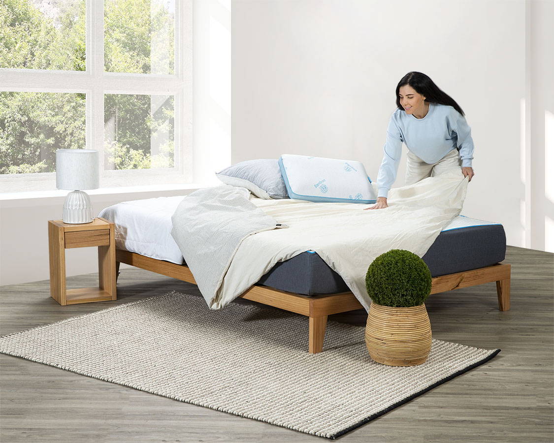A Zeek model lounging about on a Zeek bed and mattress.