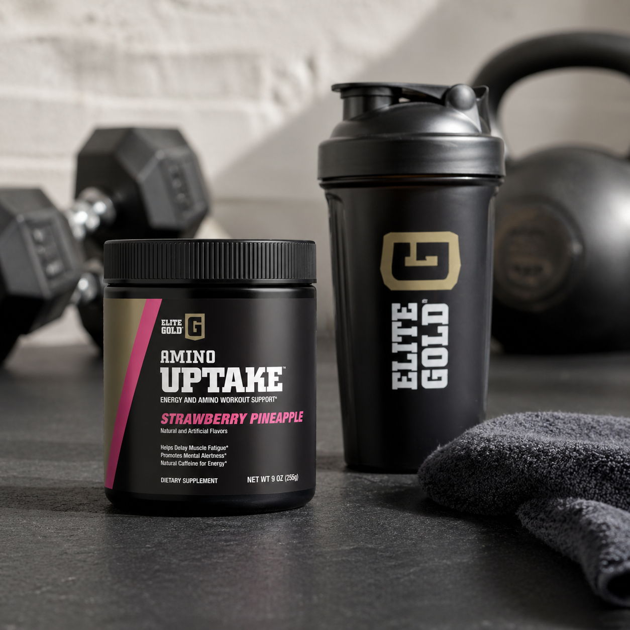 Container of amino acid powder and shaker bottle on gym surface.