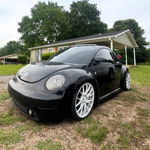 Parked three-quarter view of Jimmy's 2000 Volkswagen Beetle showing hood-mounted stack and Outlaw horn install gallery photo 2
