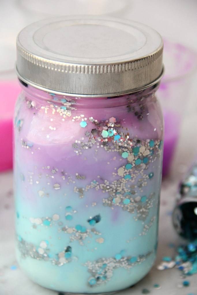 Image of colourful galaxy jar filled with silver sparkles.
