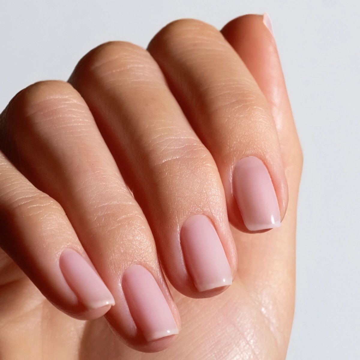 Shade Rosewater from Glossify's Endless Summer collection on a light skin tone.