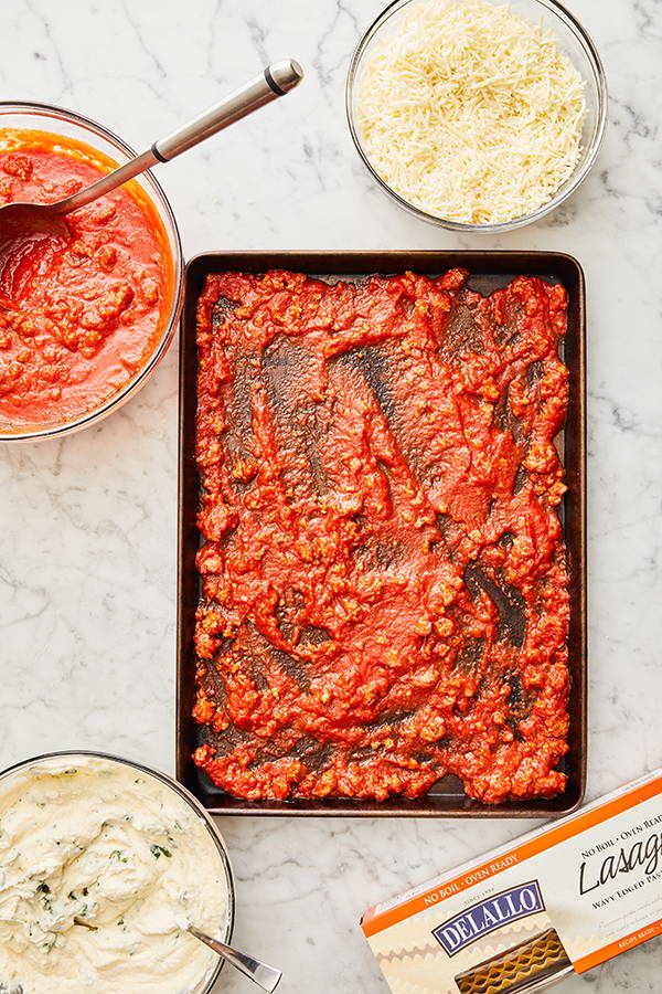 Sauce spread out on sheet pan