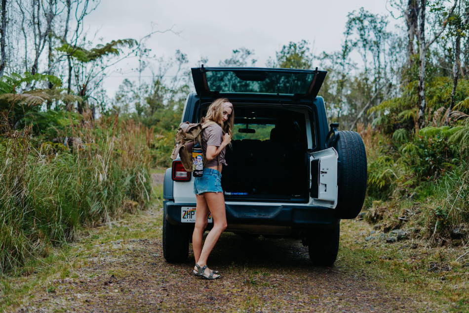 woman car camping wearing athletic sandals