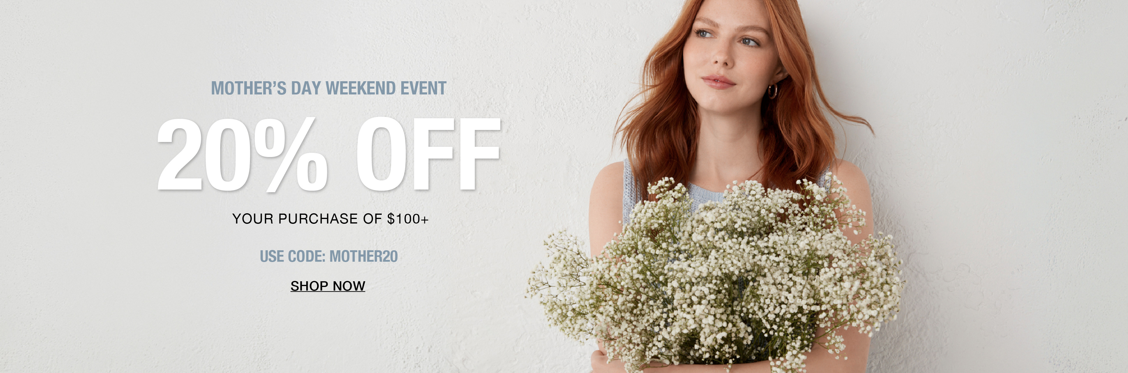 Woman holding flowers with promotional text for 20% off when you spend $100.