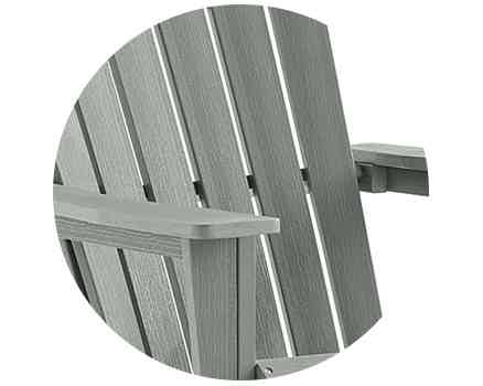 Close-up of a gray wooden Adirondack chair.