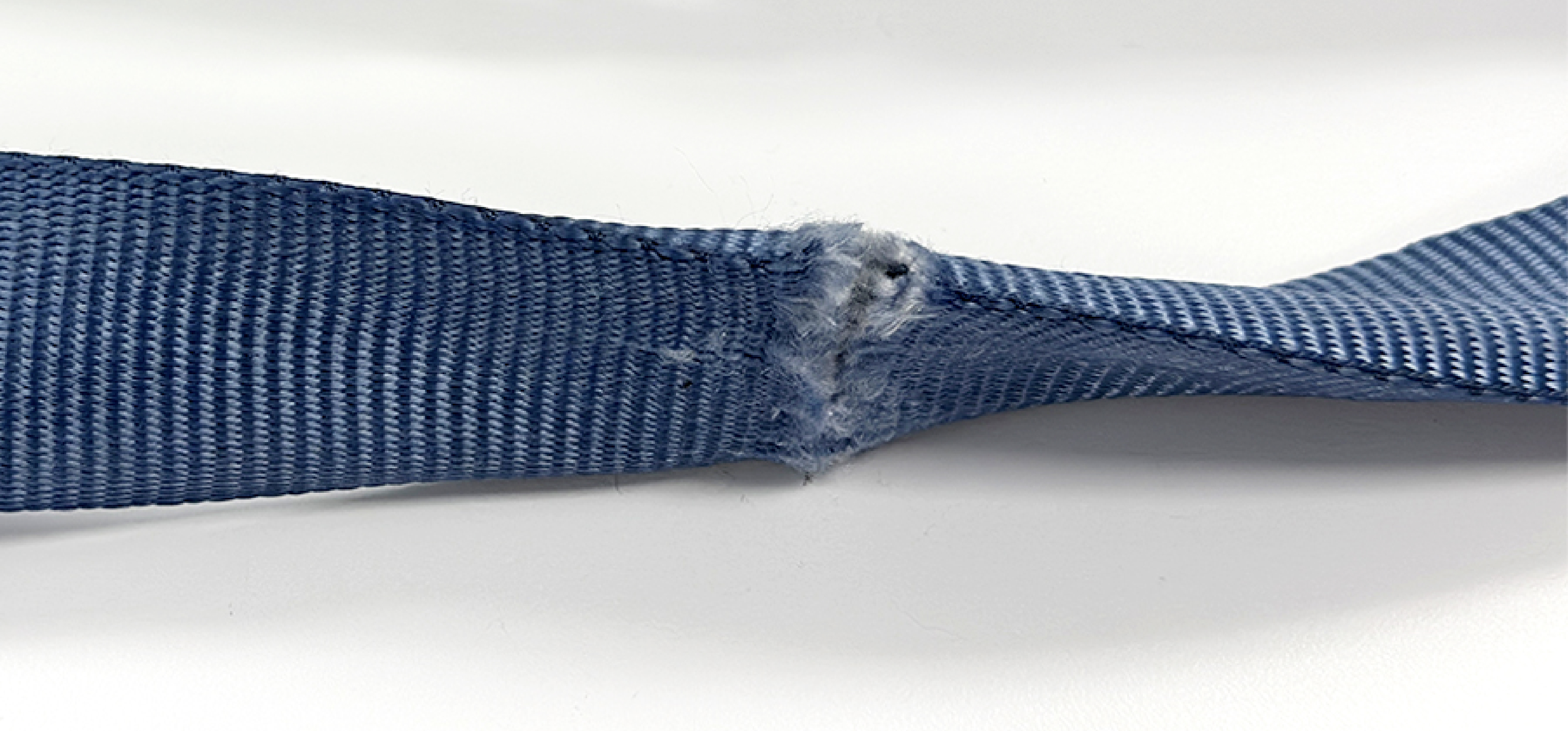 Look for damage, unreadable labels, activated impact indicators, and faulty hardware. Feel for unusual stiffness or wear.