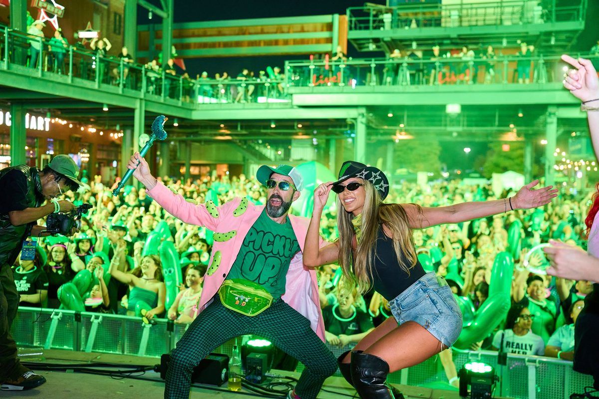 hosts hyping the night crowd on stage at The Big Dill pickle festival at Texas Live! in Arlington Texas