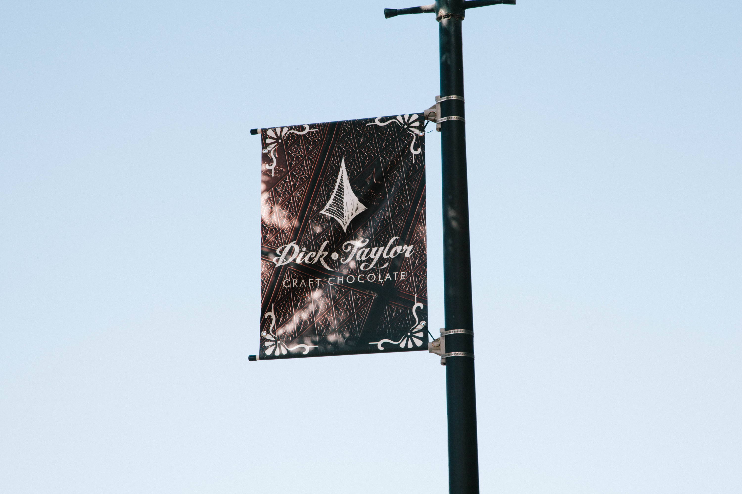 Dick Taylor craft chocolate banner on a street post