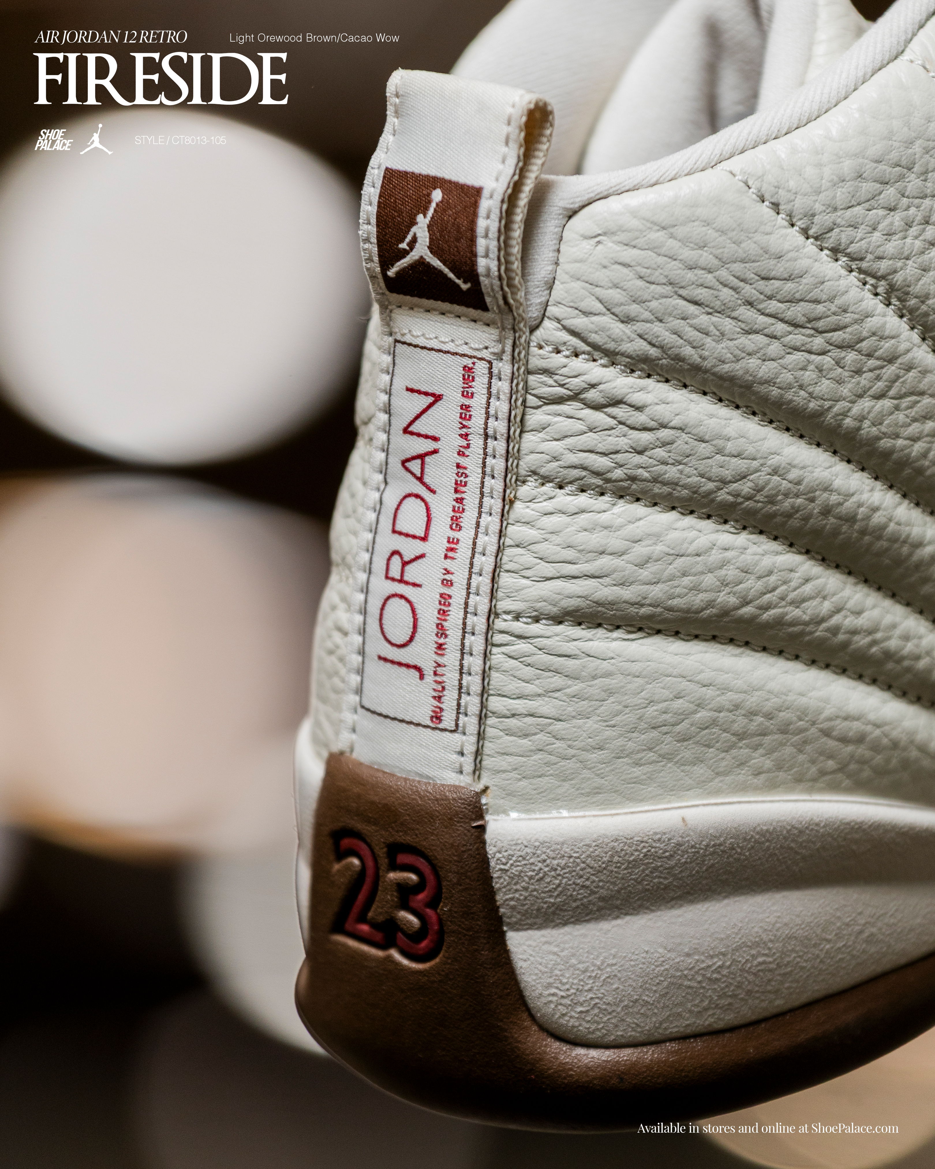 Close-up of a white Jordan sneaker with logo and tag details.