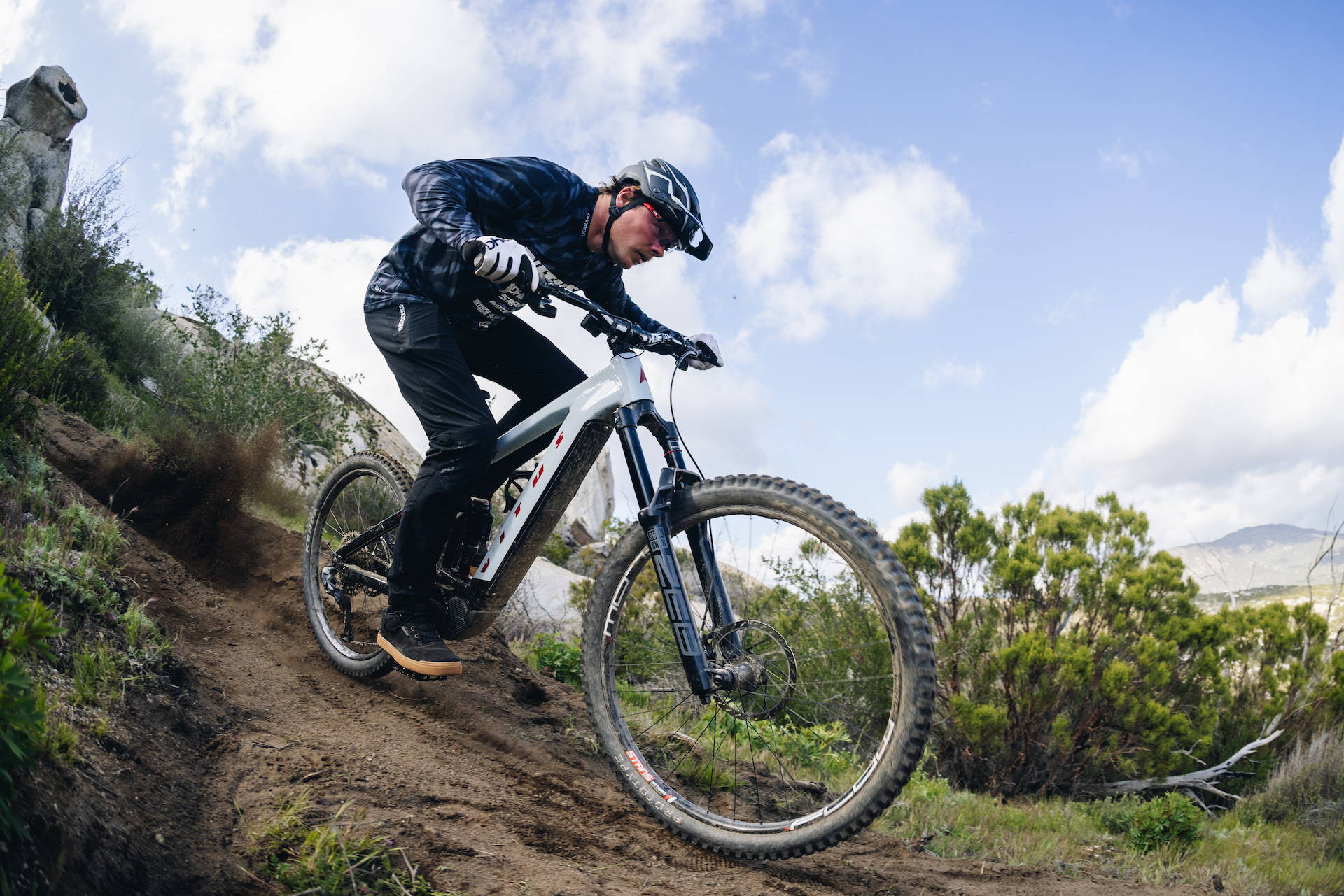 Kyle Strait riding a Vitus E-Sommet mountain bike