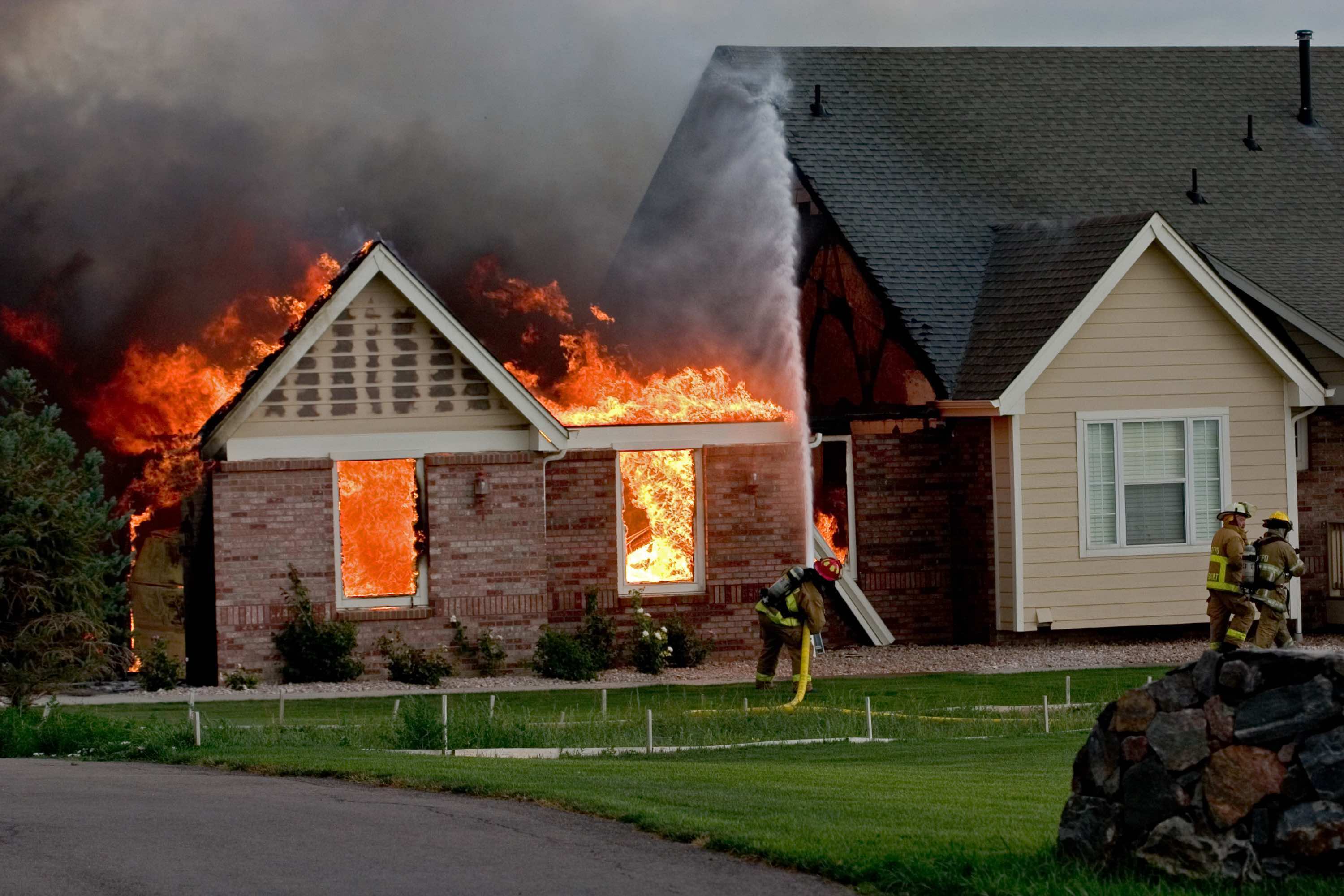 Fire Fighters Fighting House Fire