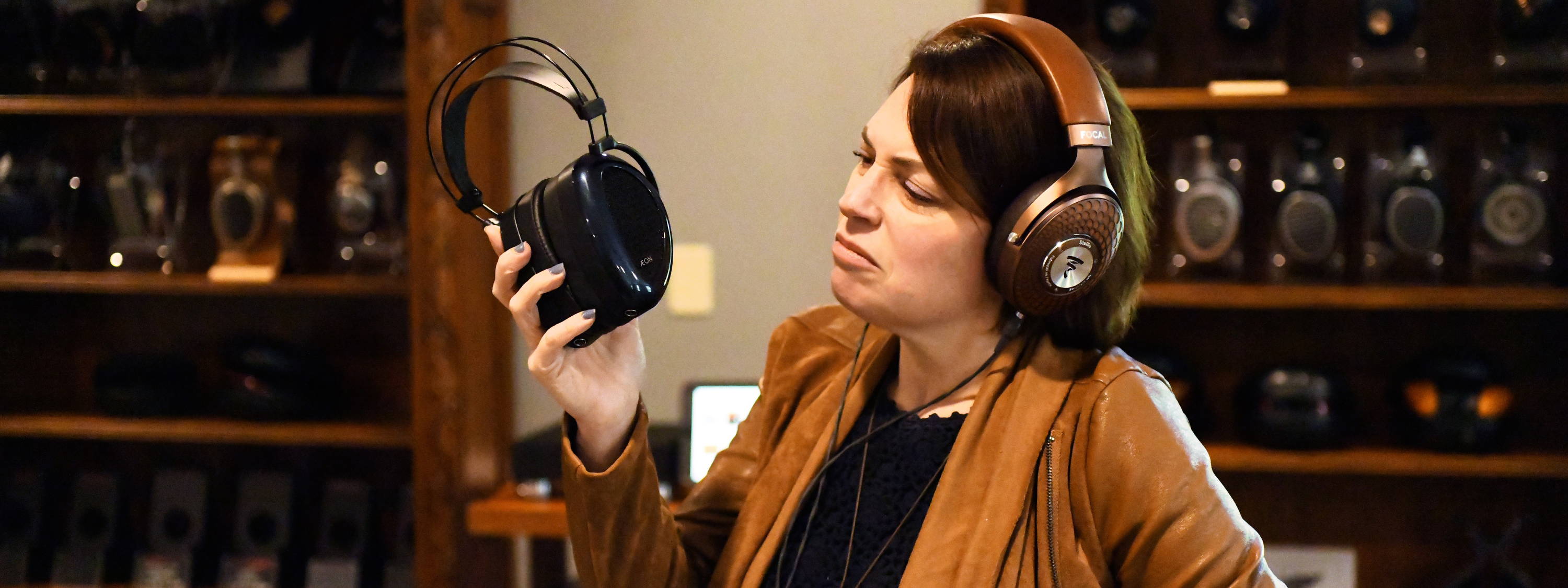 Woman looking unhappy with her headphones