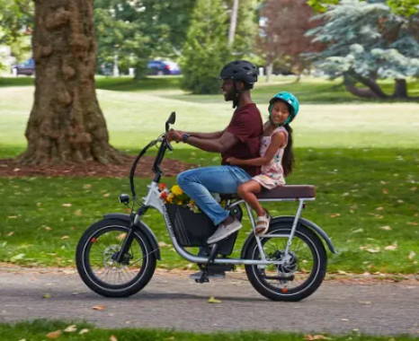 Photo of a father and daughter riding a RadRunner Ebike.
