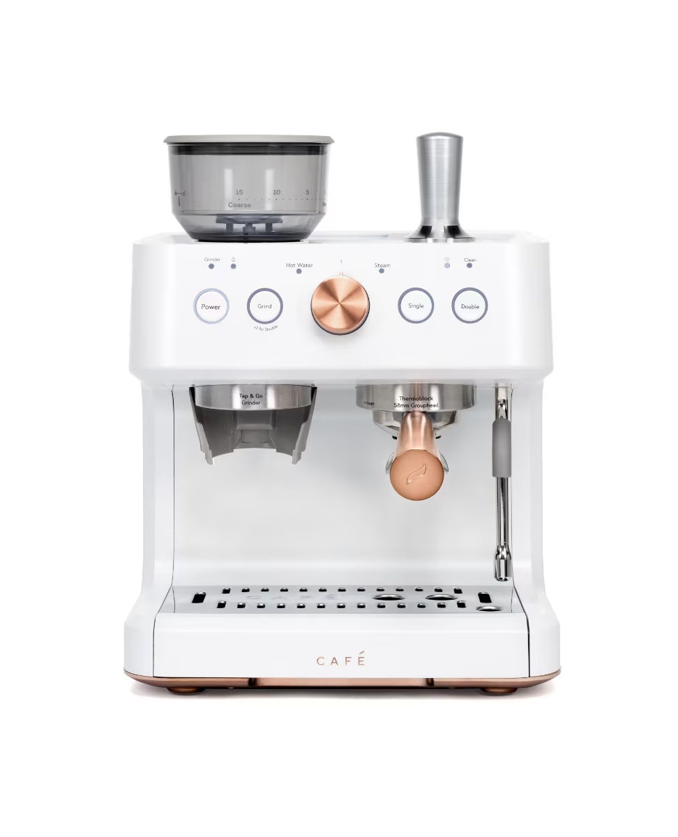 White espresso machine with copper accents and a milk frother.