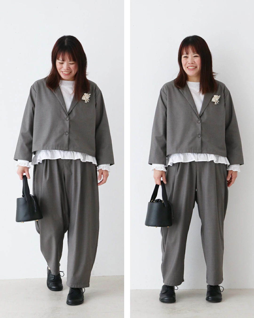 Woman in gray outfit with a handbag, smiling against a white background.