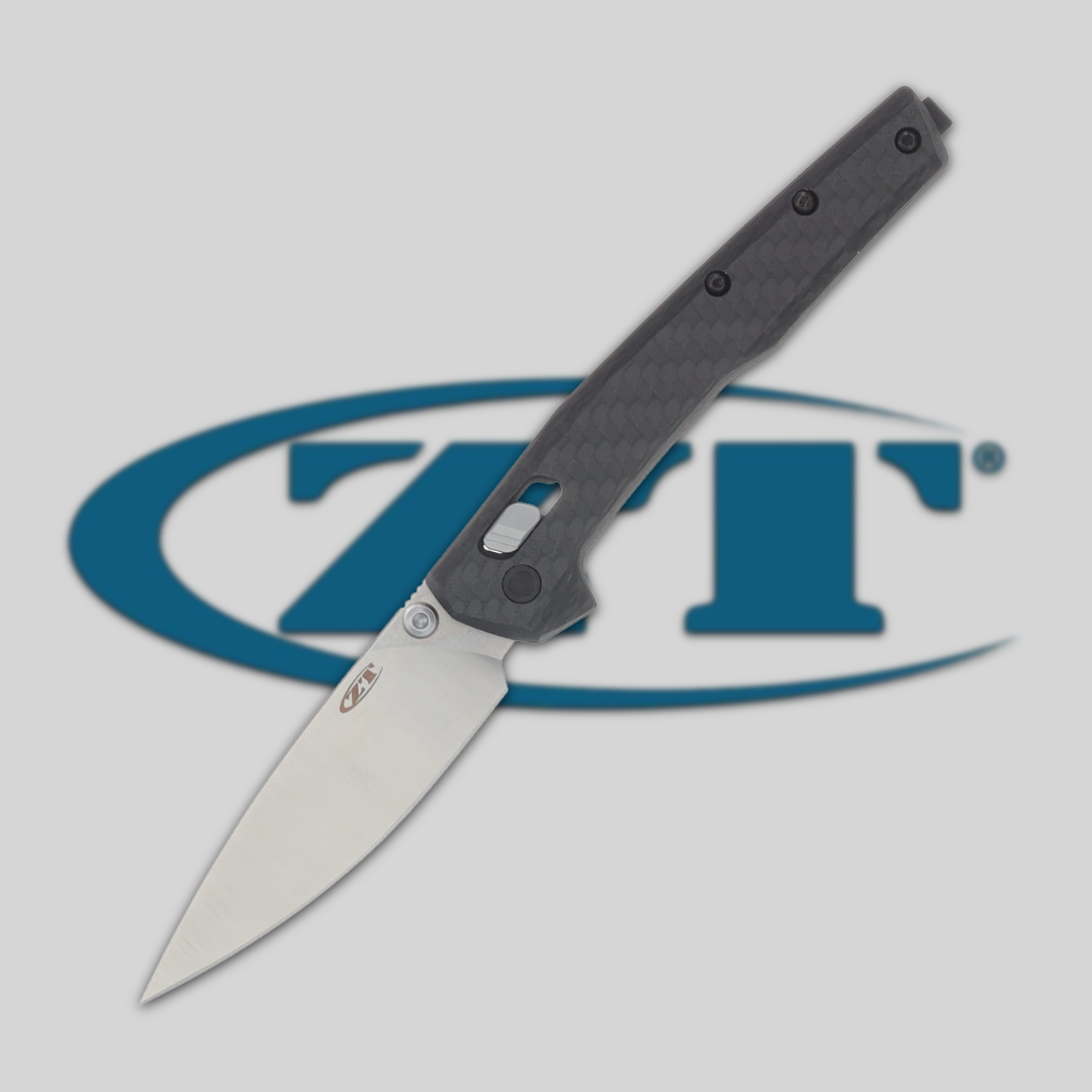 A sleek folding knife in front of a ZT logo.
