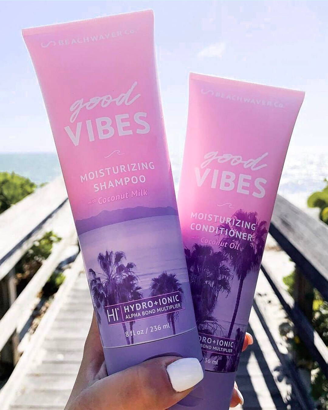 Image of Good Vibes shampoo and conditioner photographed on a dock