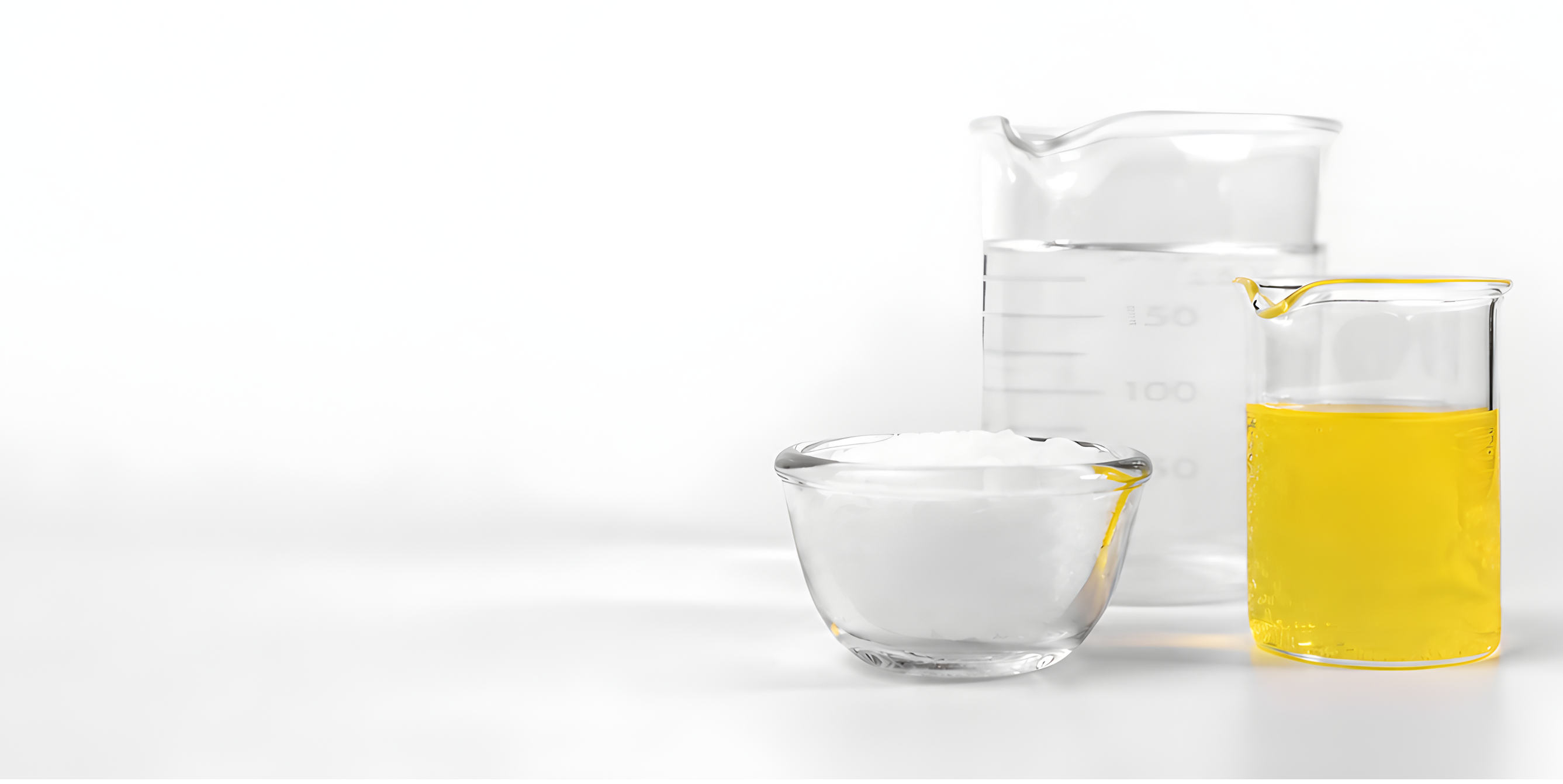 Three containers: one with yellow liquid, one with clear liquid, one empty.