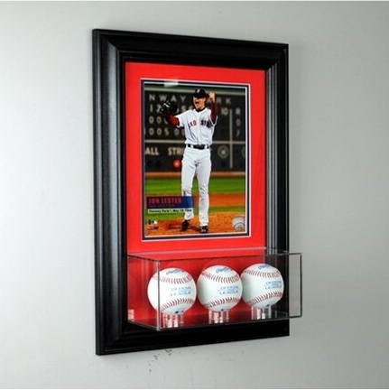 A baseball display case with a photo.