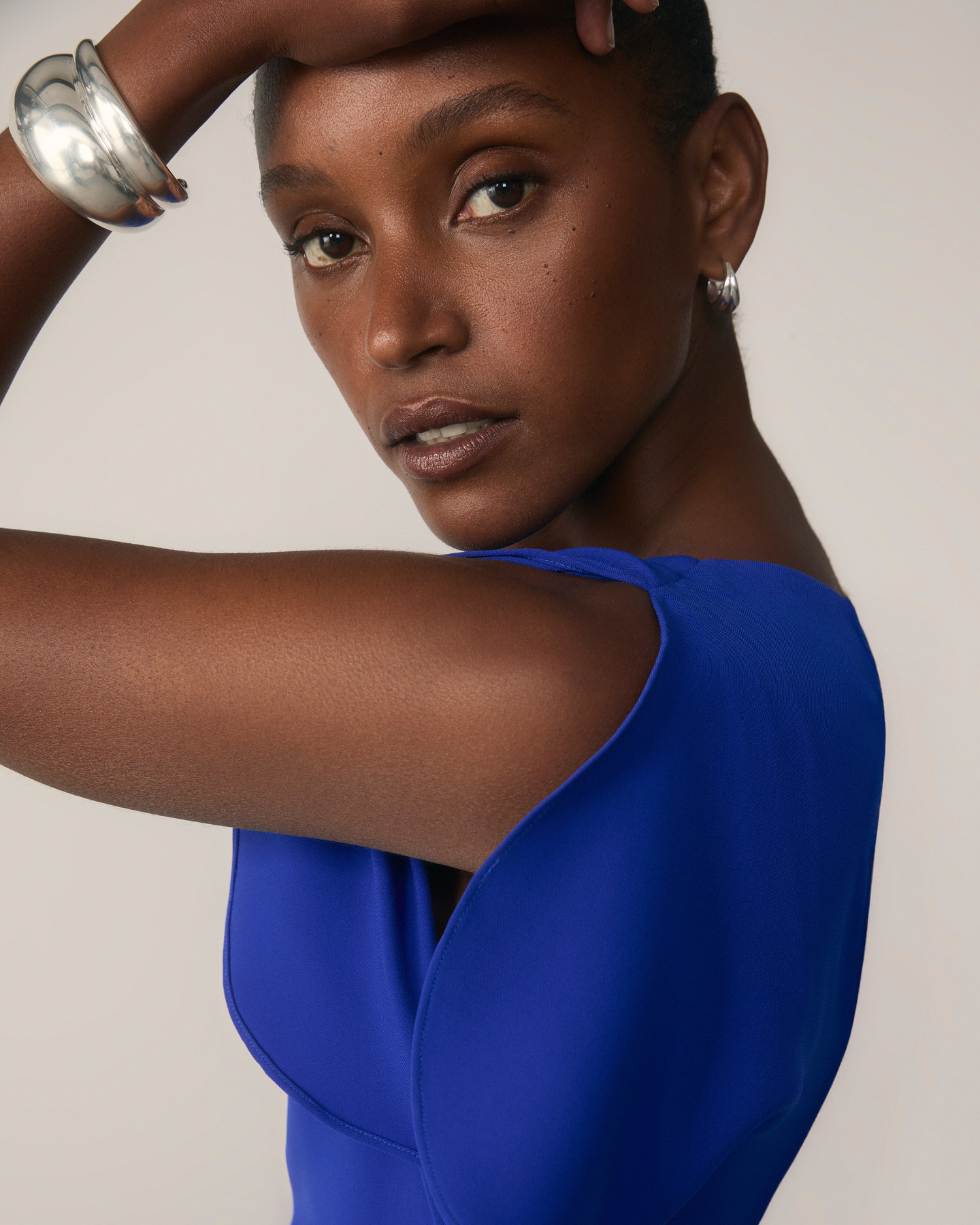 Model wearing vibrant blue Salerno dress
