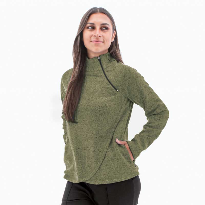 Woman wearing green Harlow zip neck fleece.