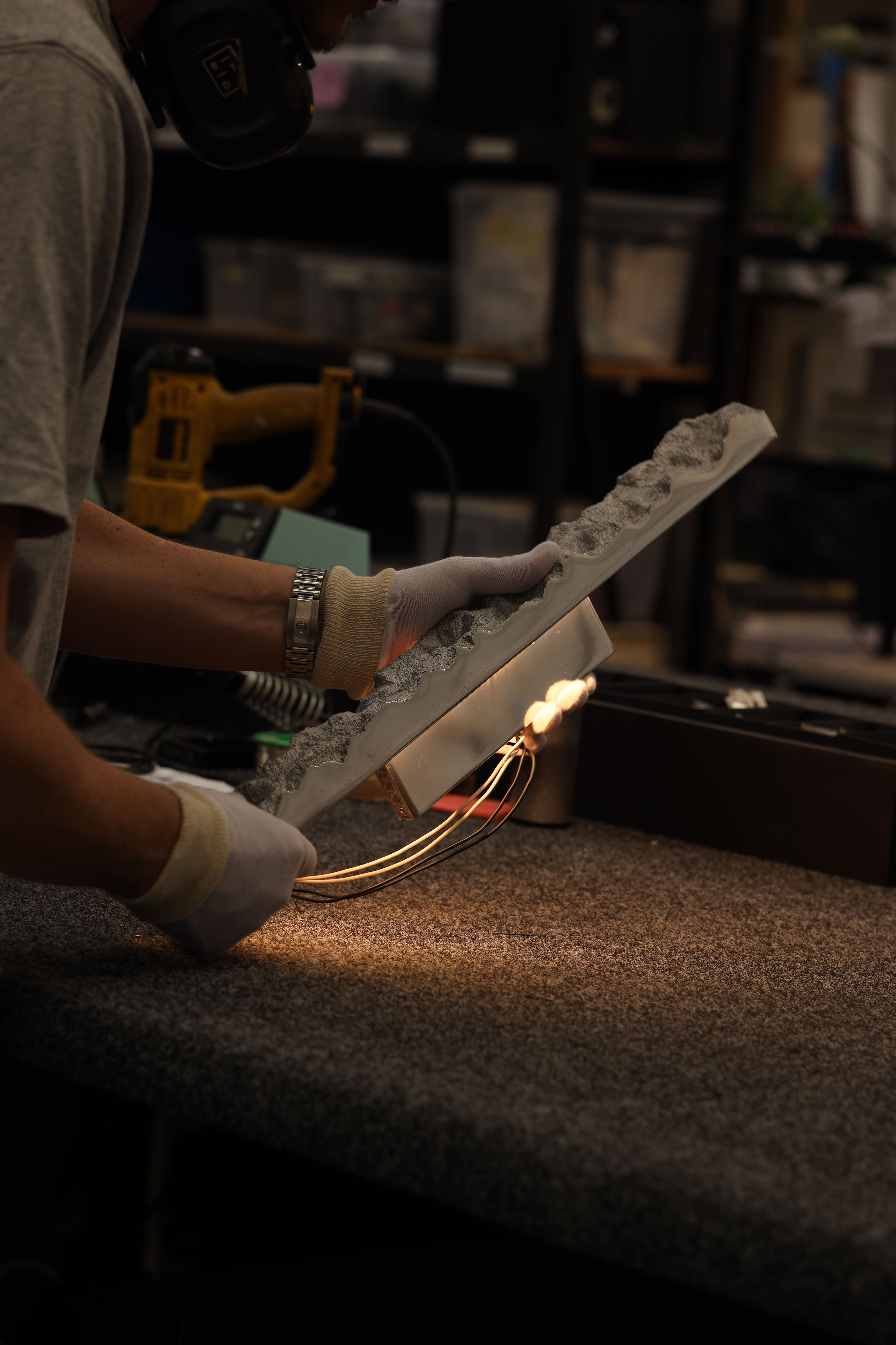 Carst Wall Sconce being assembled