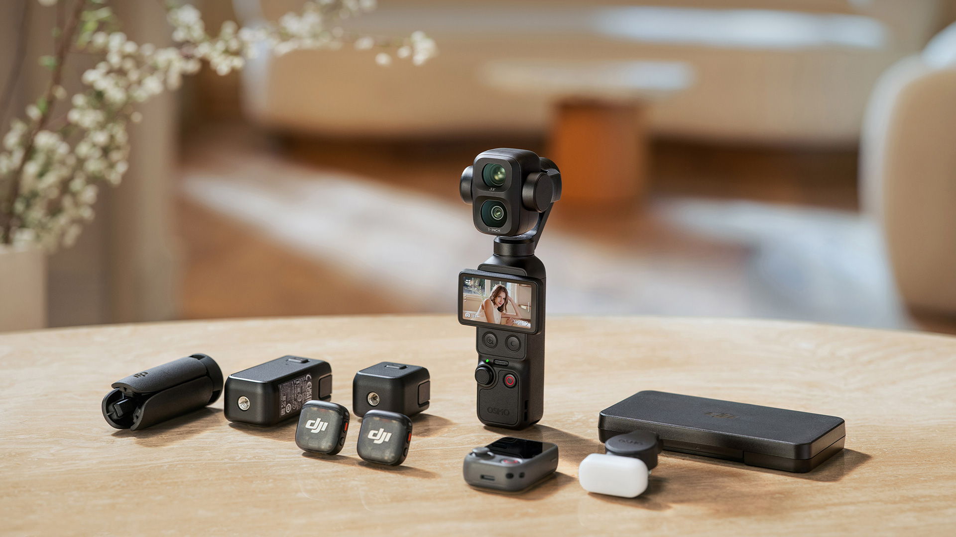 The DJI Osmo Pocket 4P and its compatible accessories arranged on a wooden table in a bright room.