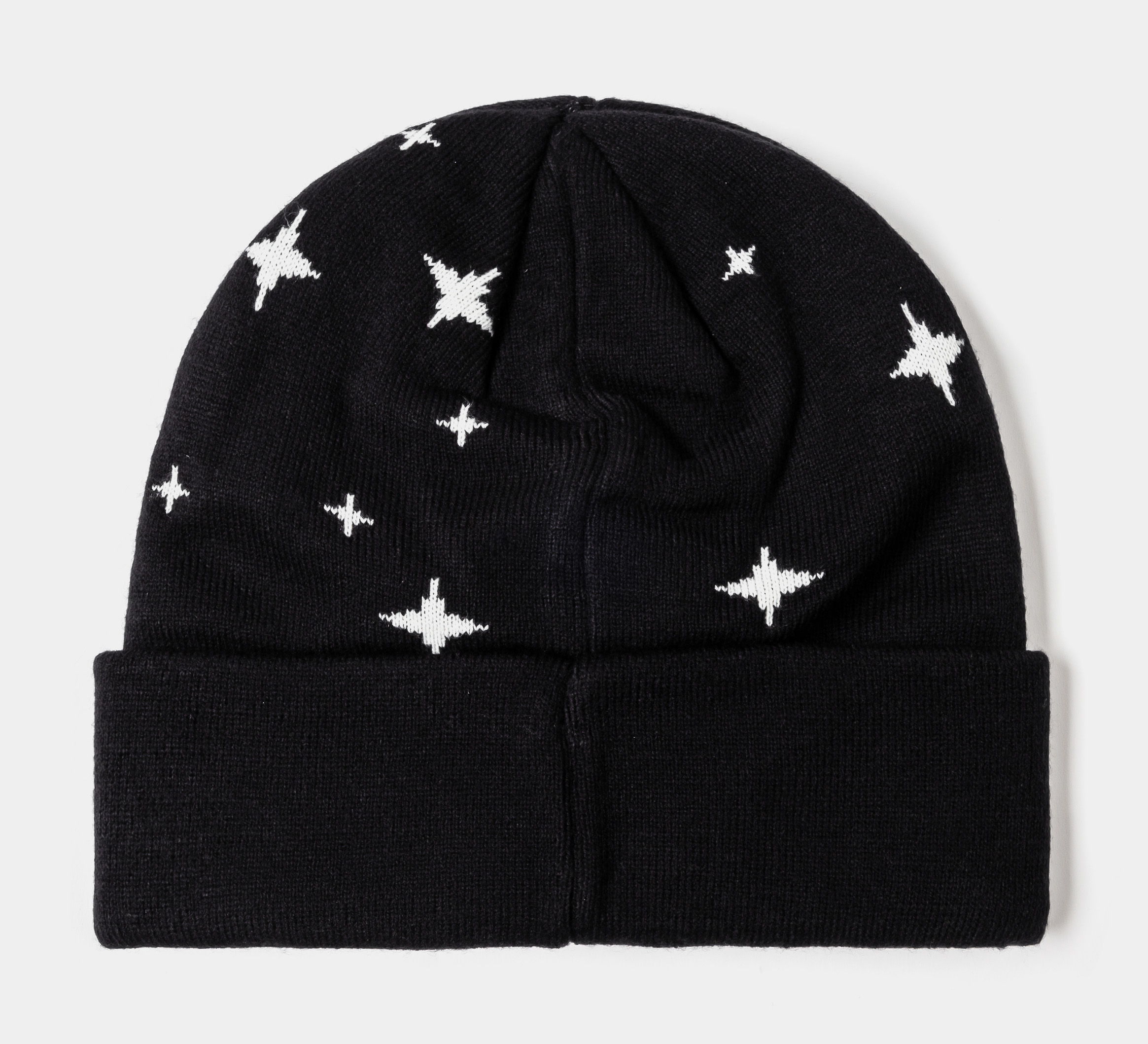 Black beanie with white cross, stars, and decorative pearls.