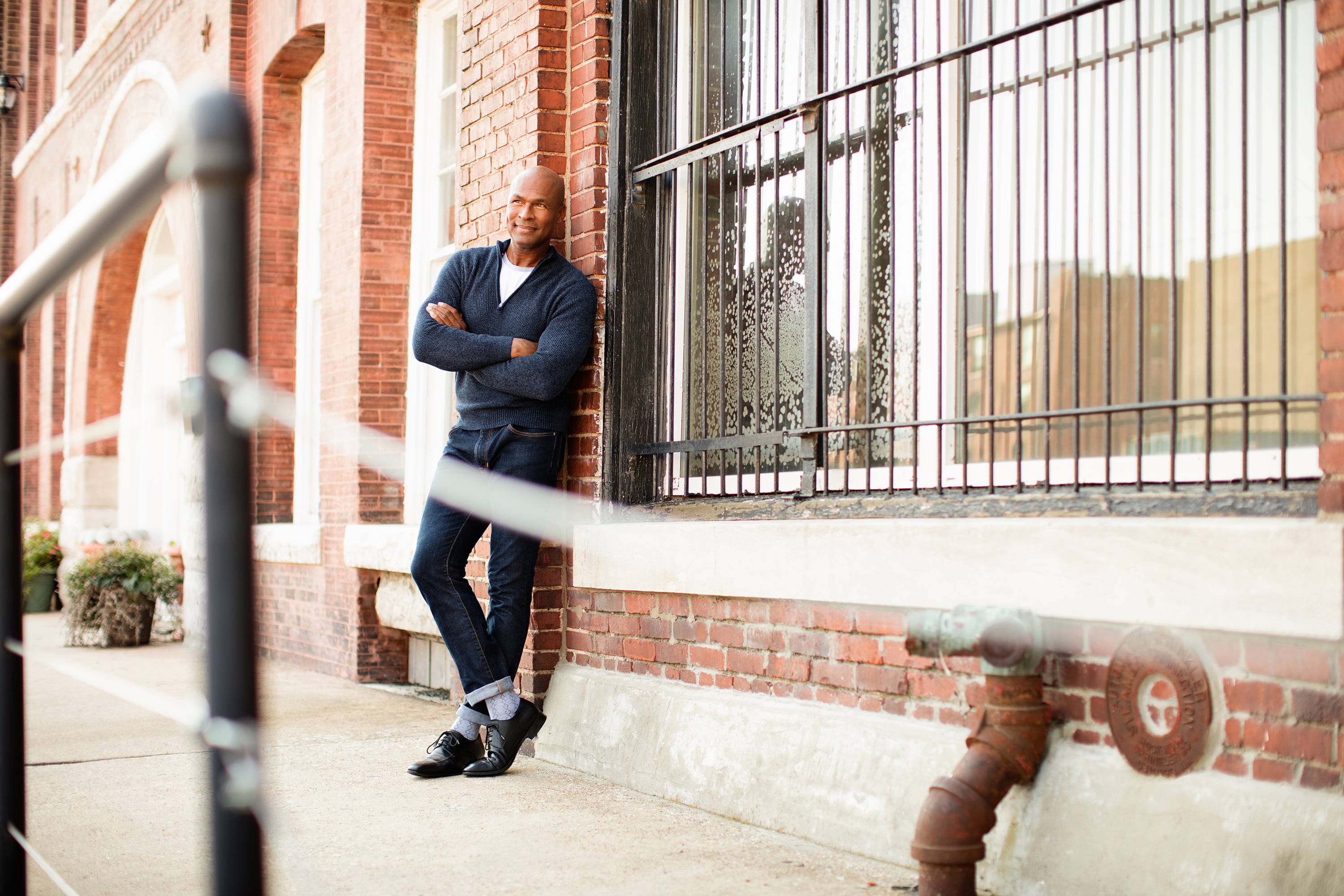 Man standing, happy man wearing Therafirm patterned socks