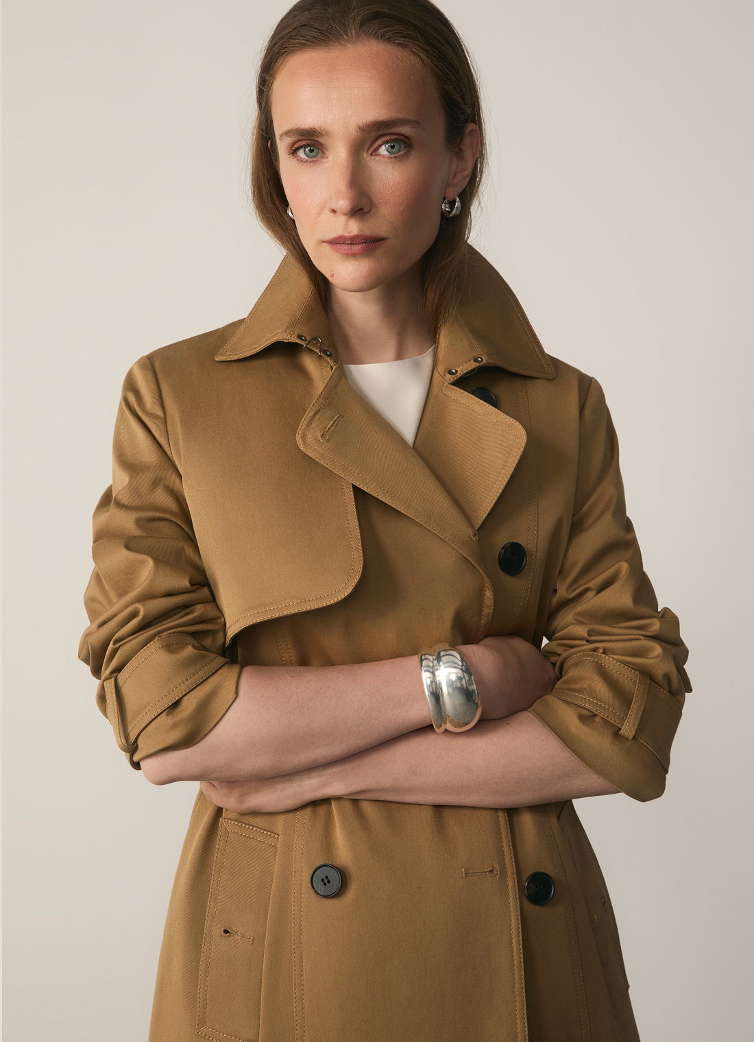 Model wearing camel Hawthorne trench coat