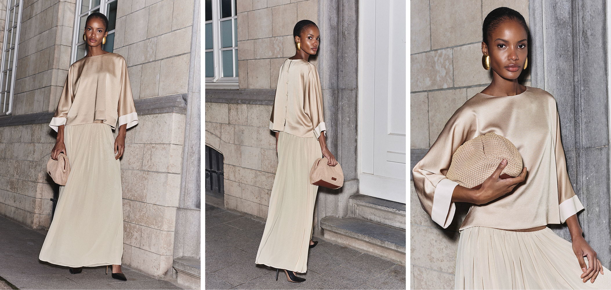 Model in a beige outfit poses against a textured wall.