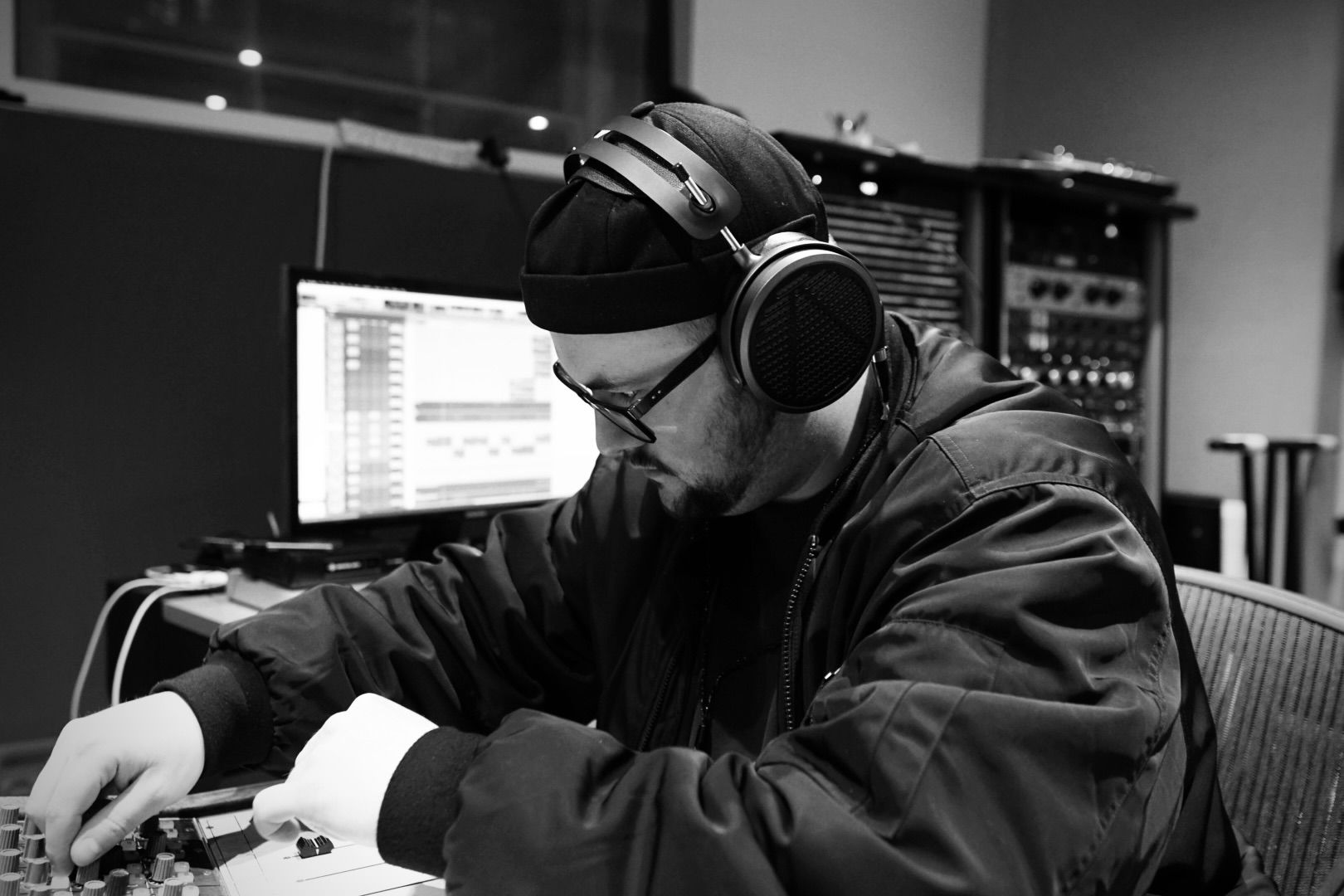 Lev Shteinberg wearing Audeze MM-500 headphones mixing in the studio 