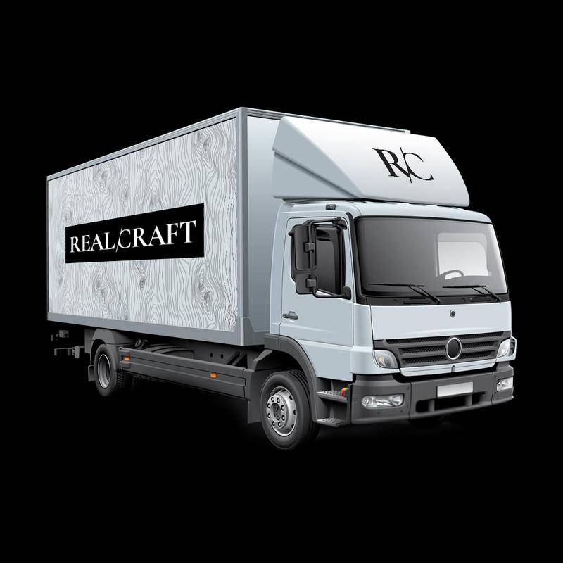RealCraft's white truck with black sticker on solid black background.
