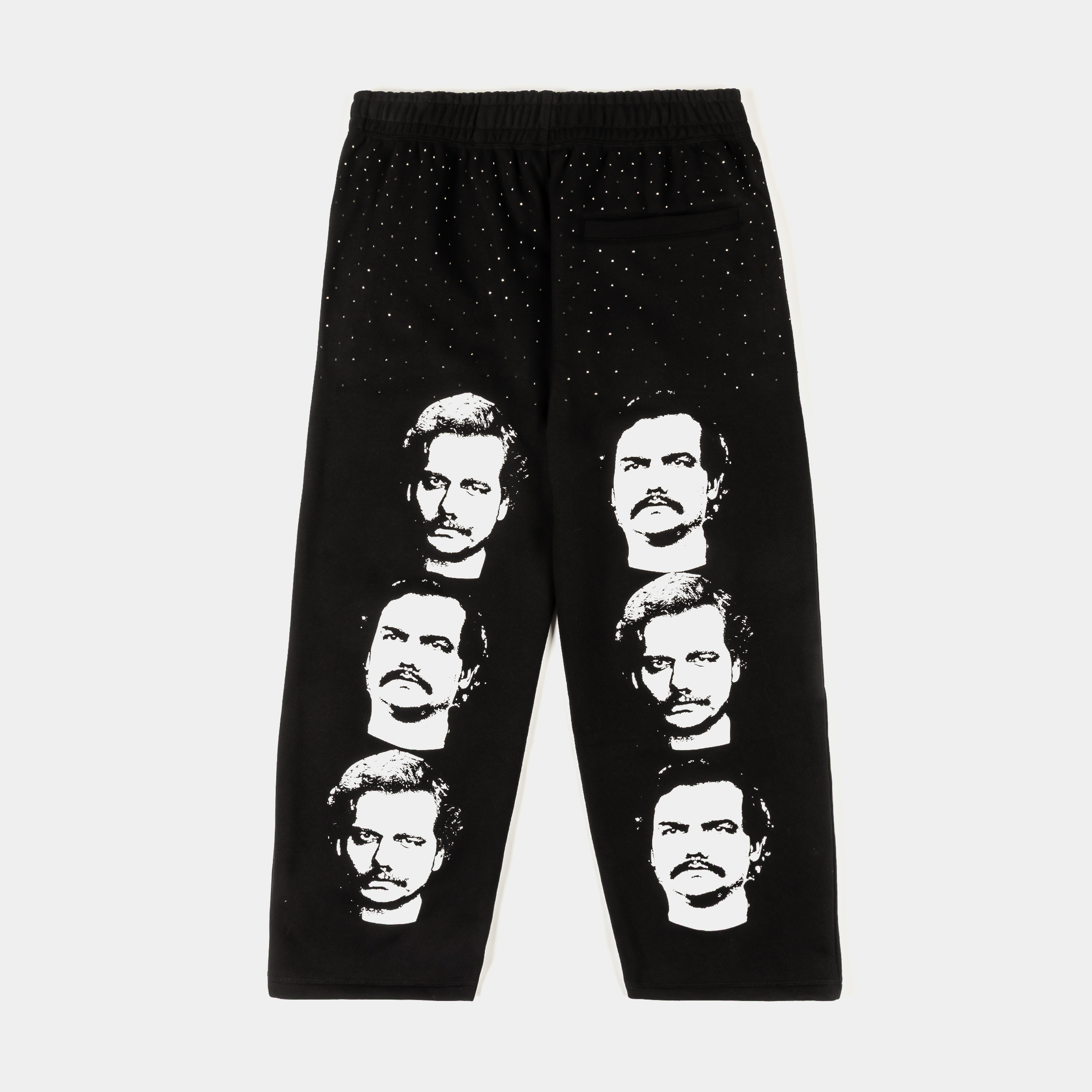 Black pants featuring multiple faces and 