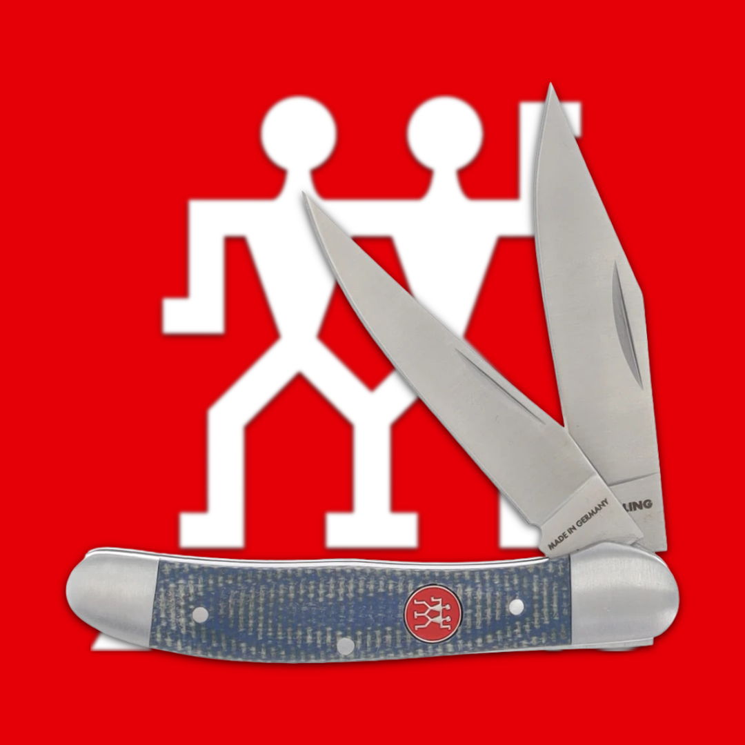 A folding knife with two blades on a red background.