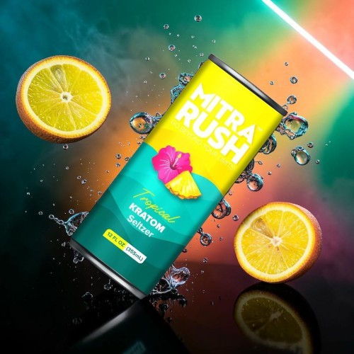Can of Mitra Rush drink with lemon slices and colorful background.