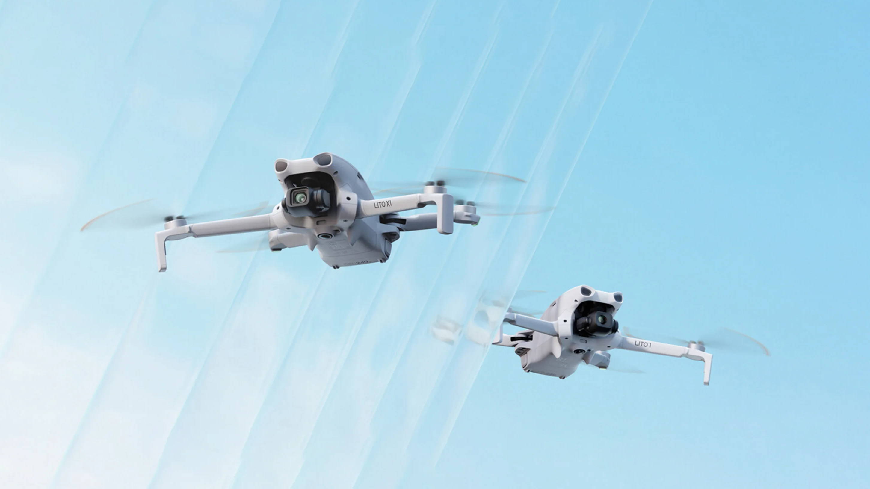 Two DJI Lito series drones flying against a blue sky.