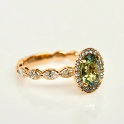 green sapphire engagement ring close up