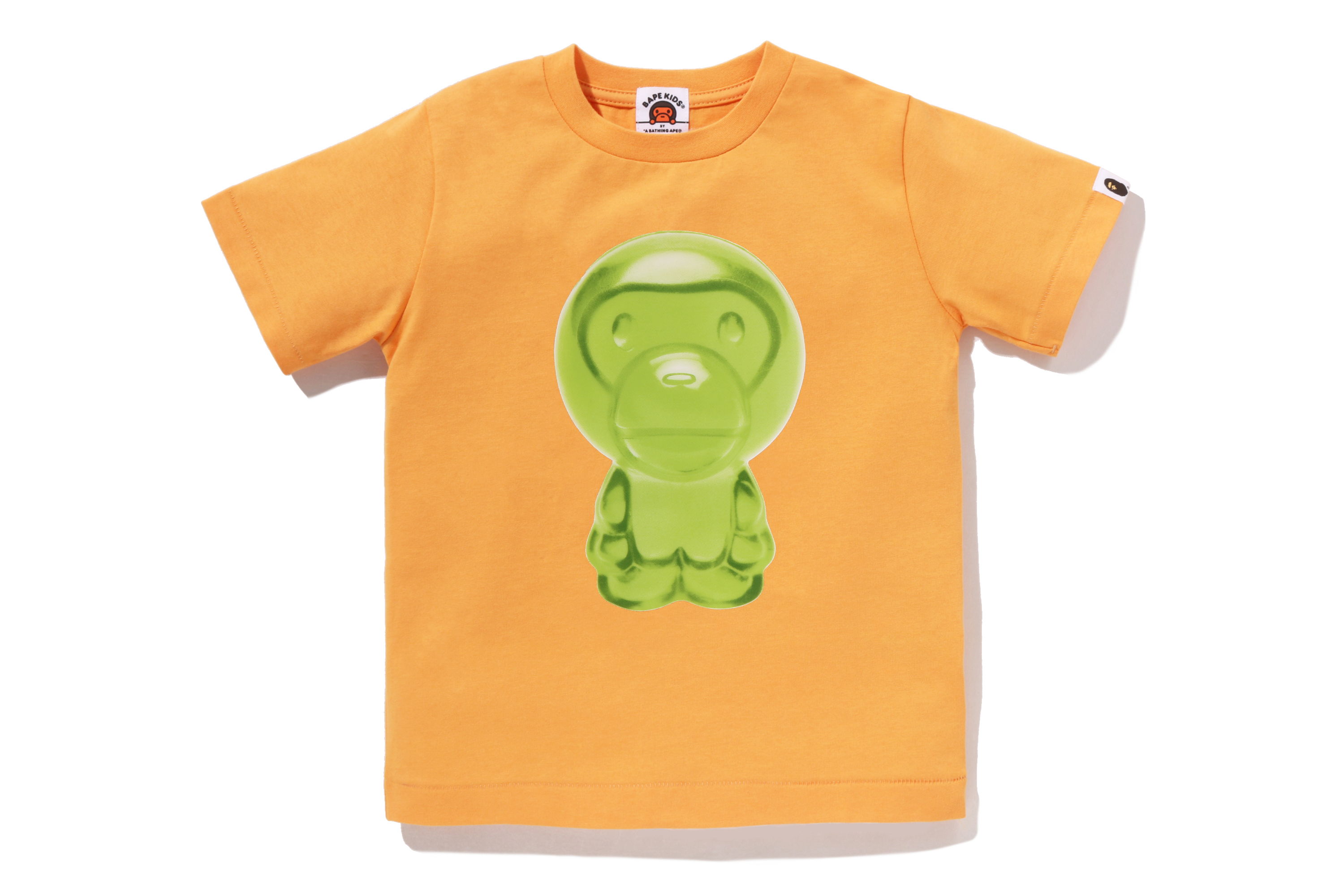 Orange t-shirt with a green cartoon character printed on the front.