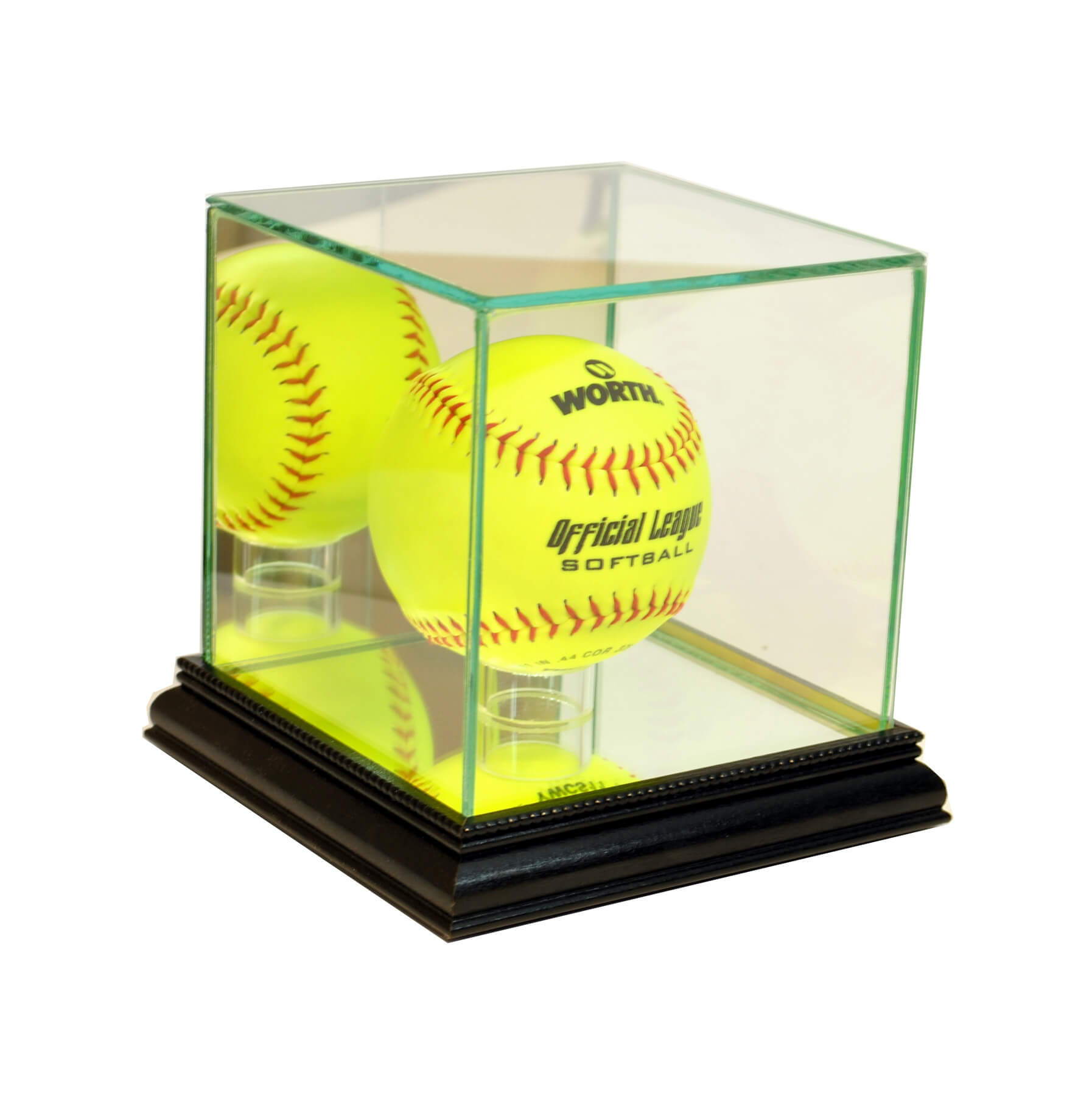 Two yellow softballs inside a glass display case on a wooden base.